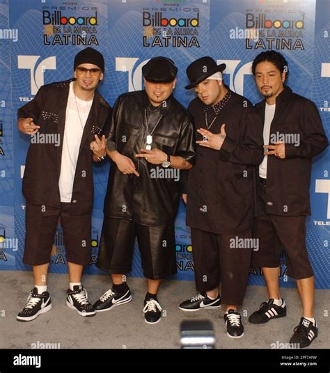 Members of the Latin band, Kumbia Kings, pose backstage at the ...