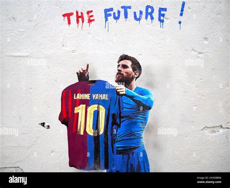 Graffiti by the artist TV Boy featuring Leo Messi holding an FC Barcelona jersey with Lamine ...