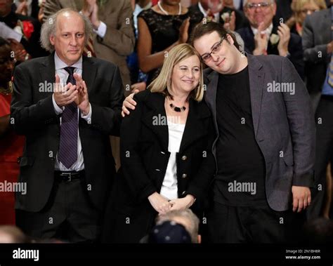 Nashville Mayor Megan Barry, center, is hugged by her son, Max, as her ...