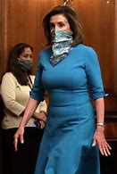 Image result for Nancy Pelosi in Blue Dress at Podium