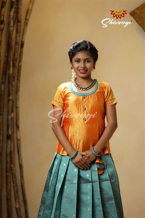 Pattu Pavadai designs in Semi Silk in Green - Pepper Flower
