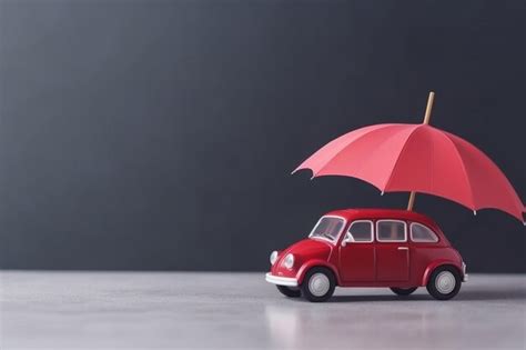 Toy umbrella and toy car with copy space car protection and insurance ...