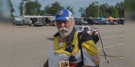 Flagman dies after race car hits him