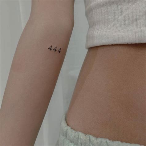 Tattoo of the number "444" in red ink located on the