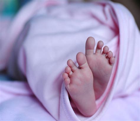 Who abandoned neonatal child in backyard of residence Bhuj Police on ...