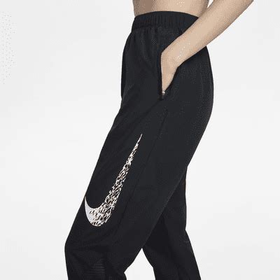 Nike Dri-FIT Swoosh Run Women's Mid-Rise Running Trousers. Nike IN
