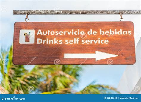 Sign in English and Spanish Showing Direction To a Bar on a Resort ...
