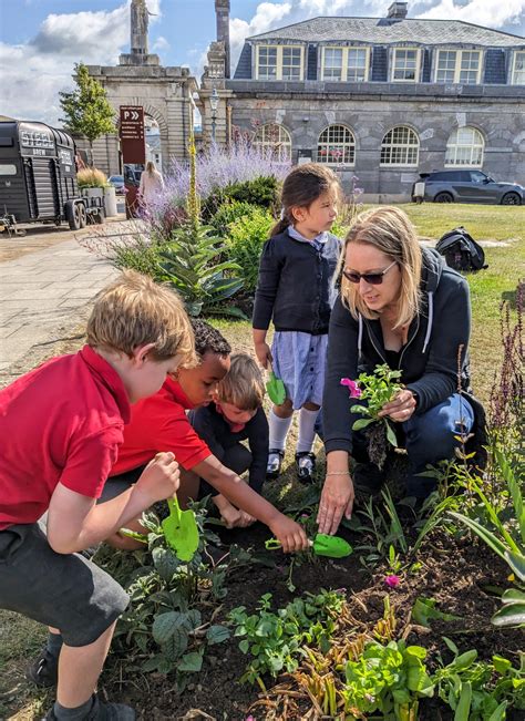 School children help with Plymouth South West in Bloom - Waterfront BID