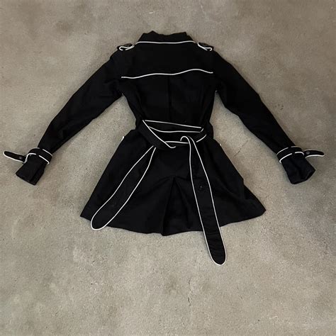 Women’s small trench coat. Black with white outline... - Depop