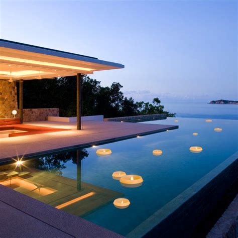 https://images.squarespace-cdn.com/content/v1/55bebb51e4b036c52ebe8c45/1444629486660-XD3I3LKRJVCEP8X5UILY/Infinity+Pool+with+Floating+Candles