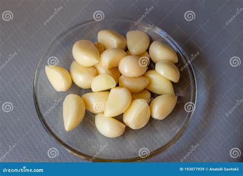 Peeled Garlic Cloves on a Plate. Preparation for Pickling Vegetables ...
