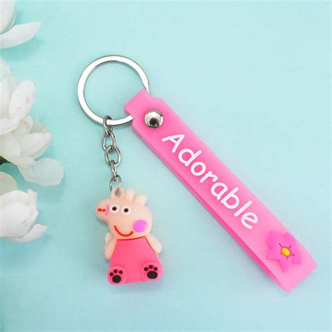 Send Chhota Bheem Rakhi with Peppa Pig Key Ring Online | Rakhibazaar.com