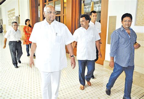 NCP leader Sharad Pawar arrives for the meeting along with Surendra ...