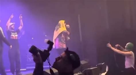 Kneecap band member charged with terrorism for displaying Hezbollah flag at concert - Jewish ...
