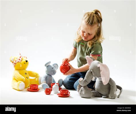 girl toddler having Teddy Bear tea party Stock Photo - Alamy