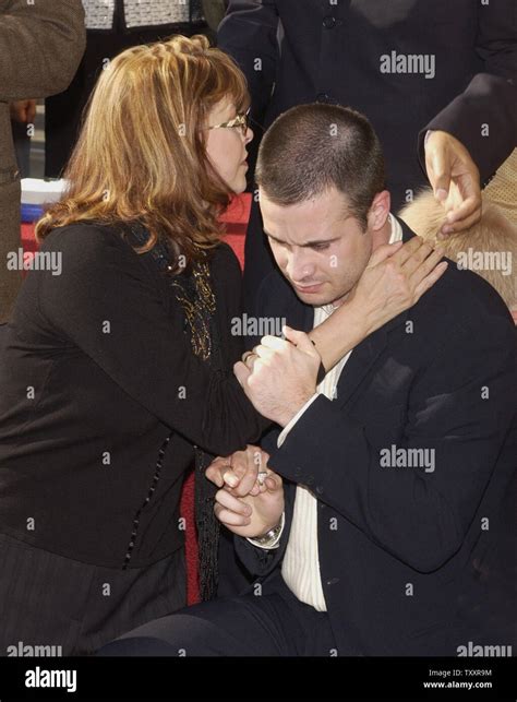 Actor Freddie Prinze, Jr. and his mother Kathy hug each other as his ...