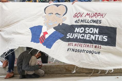 In protest and performance, groups demand funding for immigrant ...