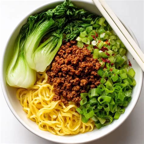 Dan Dan Noodles: Savor the Spicy Pork & Crunchy Greens Delight