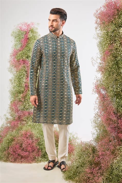 This Mirror Work Kurta showcases the grandeur of Heavy Zari and Sequin ...