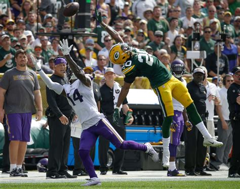 Download Aaron Jones looks to fight for extra yards in a game ...