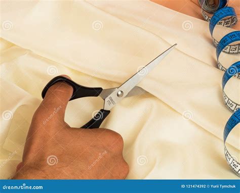 Cutting Out of Textile with Scissors. Closeup Stock Photo - Image of ...