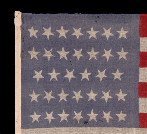 34 TUMBLING STARS on an ANTIQUE AMERICAN FLAG, CIVIL WAR PERIOD, 1861 ...