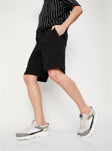 Buy Men Solid Athleisure Cargo Shorts Online at just Rs. 699.0 ...