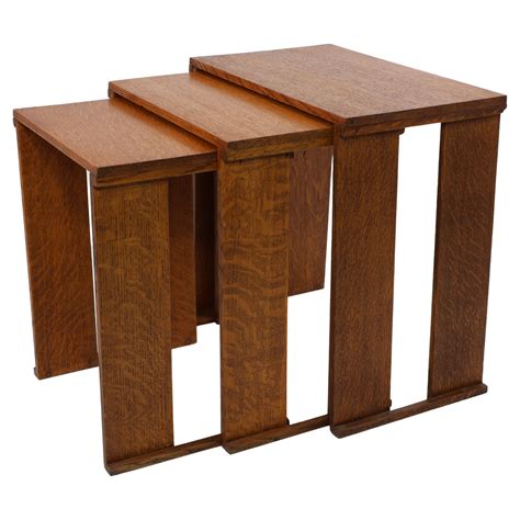 A nest of three Art Deco wild grain oak side tables of planked construction. For Sale at 1stDibs