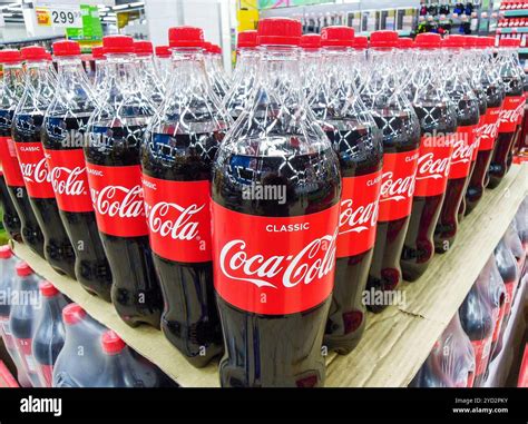 Coca Cola drinks ready for sale on the shelf in superstore Stock Photo ...