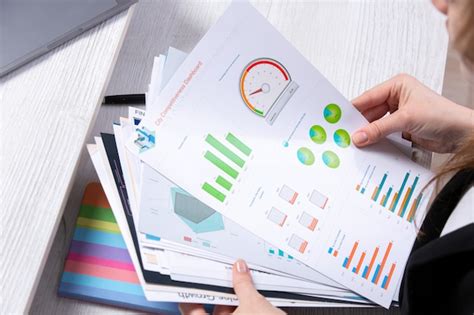 A front view graphics and schedules getting checked by a young lady ...