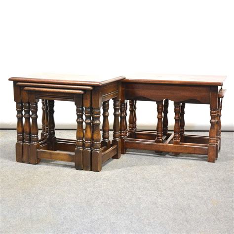 Lot 336 - Two nests of oak occasional tables,