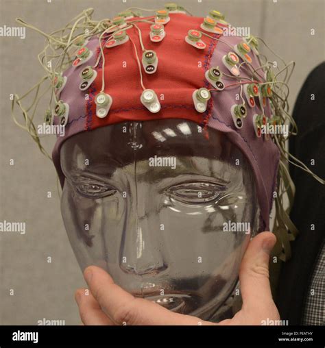 A traditional electroencephalogram (EEG) setup involves placing multiple electrodes, sensors ...