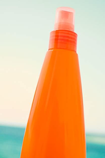Suntan lotion spf protection and skin care sun tan bottle on the beach ...