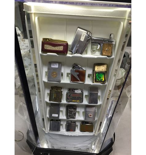 COLLECTION OF 46 VINTAGE LIGHTERS WITH ZIPPO DISPLAY CASE - Able Auctions