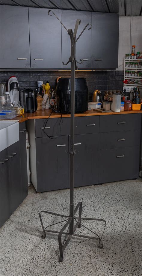 Lot - A wrought iron hat stand, Height 190cm