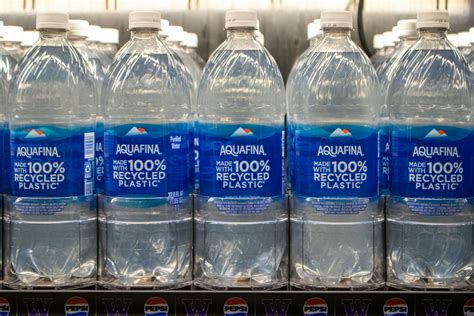 Bottles of aquafina water made from recycled plastic. photo – Free ...
