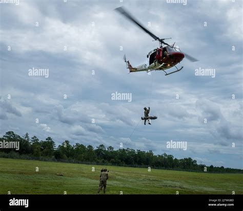 A 413th Flight Test Squadron UH-1 Huey lifts two 20th Air Support ...