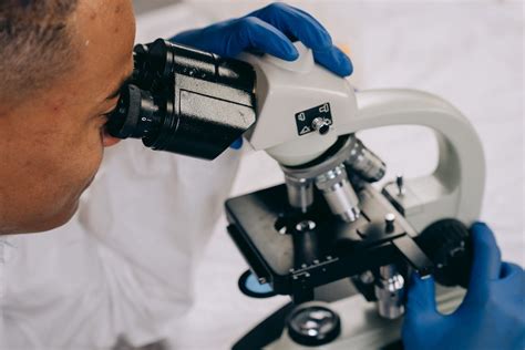Image result for A Person Inspecting Using Microscope