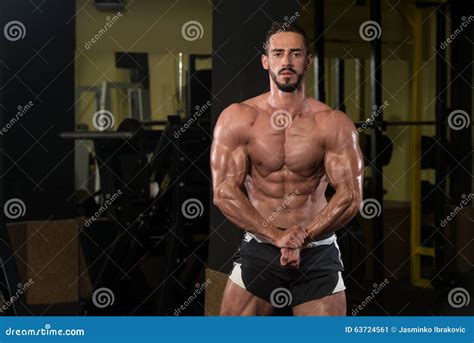 Handsome Body Builder Making Most Muscular Pose Stock Image - Image of ...