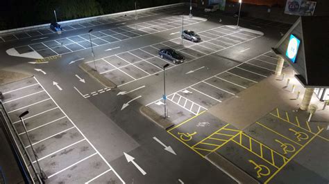 Professional contractor team applying durable car park line markings