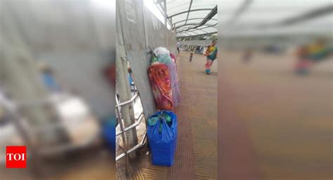PEOPLE USING WALKWAY AS HOME - Times of India