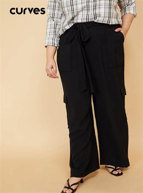 Buy Women Solid Loose Fit Cargo Trousers Online at just Rs. 1299.0 ...