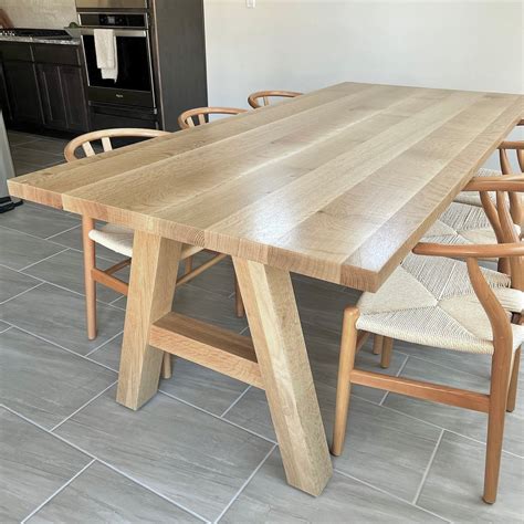 Elegant White Dining Table with Oak Legs for Modern Homes