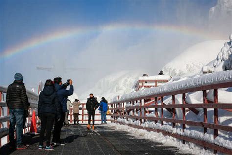 Water flowing around ice sits at the base of the American Falls due to ...