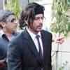 Shah Rukh Khan arrives at the quiz show 'Dare 2011' which was organised ...