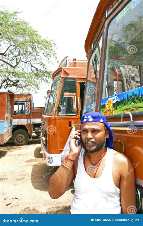 Indian Truck Driver Talking on His Mobile Phone with Trucks Parked on ...