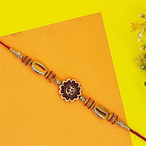 Buy ascension ® Om Gold Plated Kudan Stone Pearl Rakhi Designer Rakhi ...