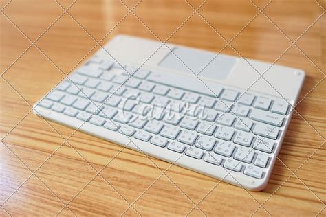 Mini Computer keyboard with pad - Photos by Canva