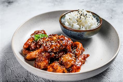 Chinese food pork in sweet and sour sauce with rice. gray background ...
