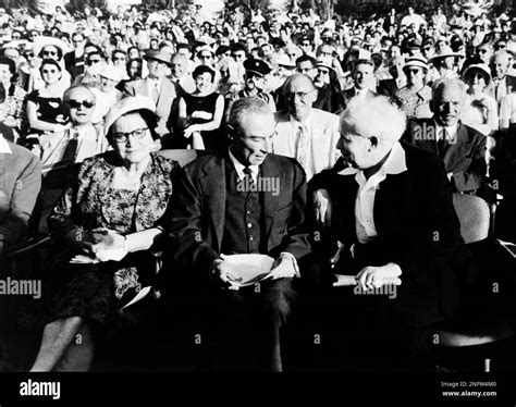 Robert Oppenheimer, center, renowned U.S. physicist sits between ...